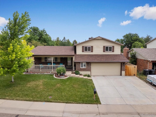 6166 S Dover St, Littleton, CO 80123 - tri-level home with covered porch, brick siding, concrete driveway, a garage, and a shingled roof