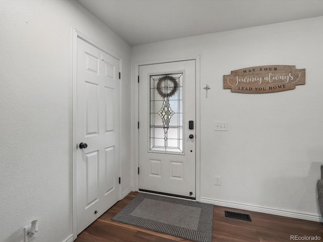 6166 S Dover St, Littleton, CO 80123 - entrance foyer featuring dark wood-style floors and baseboards