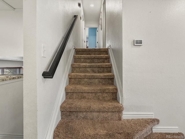 6166 S Dover St, Littleton, CO 80123 - staircase with a textured wall