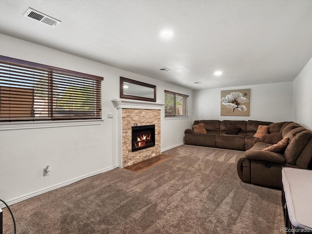 6166 S Dover St, Littleton, CO 80123 - carpeted living room with a stone fireplace and recessed lighting