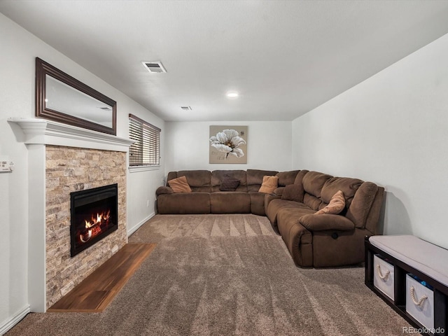 6166 S Dover St, Littleton, CO 80123 - living room featuring carpet flooring and a stone fireplace