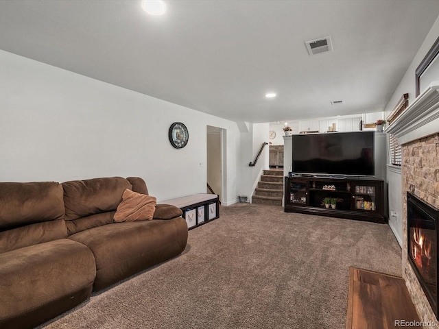 6166 S Dover St, Littleton, CO 80123 - carpeted living area featuring stairway, a stone fireplace, and recessed lighting