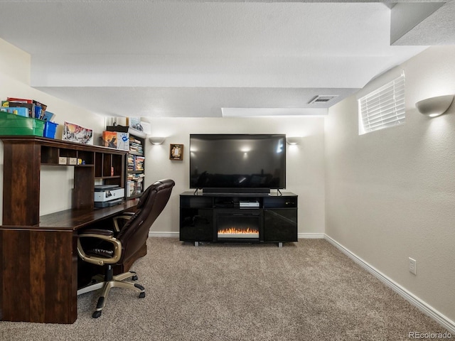 6166 S Dover St, Littleton, CO 80123 - carpeted home office featuring baseboards and a warm lit fireplace