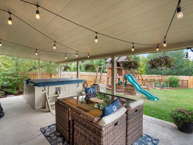 6166 S Dover St, Littleton, CO 80123 - fenced backyard featuring a hot tub, a patio, a playground, and outdoor dining space