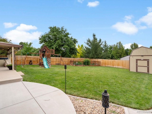 6166 S Dover St, Littleton, CO 80123 - fenced backyard with a storage shed, a playground, and a patio area