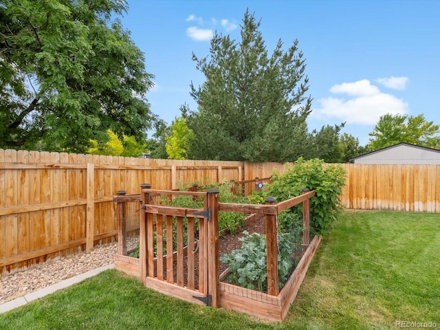 6166 S Dover St, Littleton, CO 80123 - fenced backyard featuring a garden