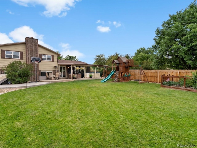 6166 S Dover St, Littleton, CO 80123 - view of yard with a playground and a patio area