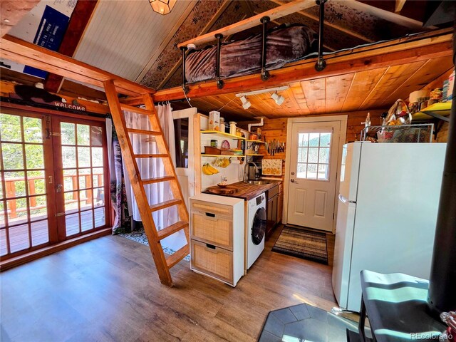 163 Ward St, Bailey, CO 80421 - clothes washing area featuring laundry area, washer / dryer, wood finished floors, french doors, and a sink