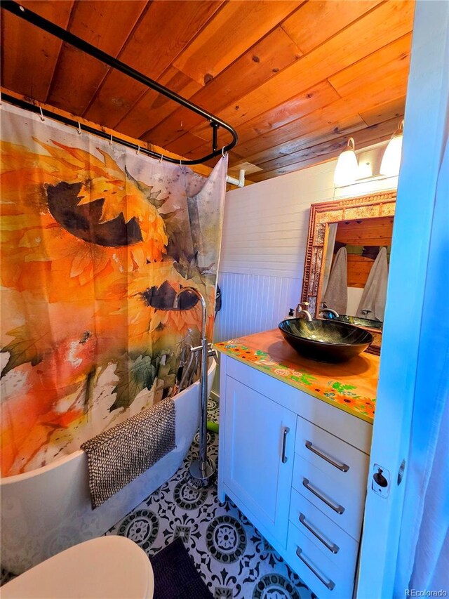 163 Ward St, Bailey, CO 80421 - full bath featuring vanity, wood ceiling, shower / bath combination with curtain, and toilet