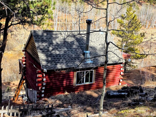 163 Ward St, Bailey, CO 80421 - view of side of home with log siding and a shingled roof