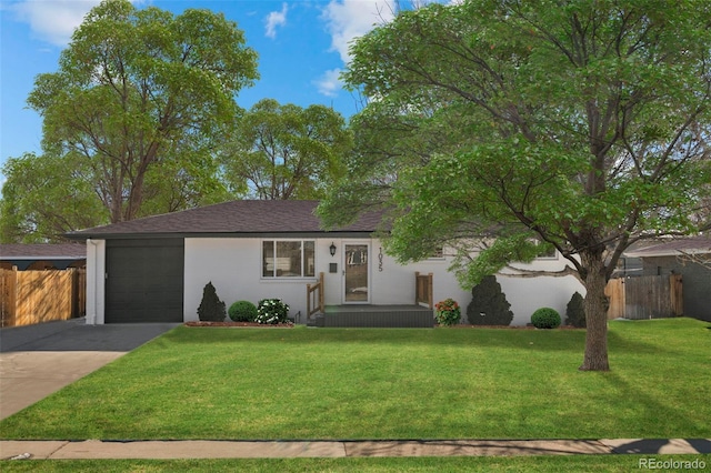 ranch-style house with a garage and a front lawn