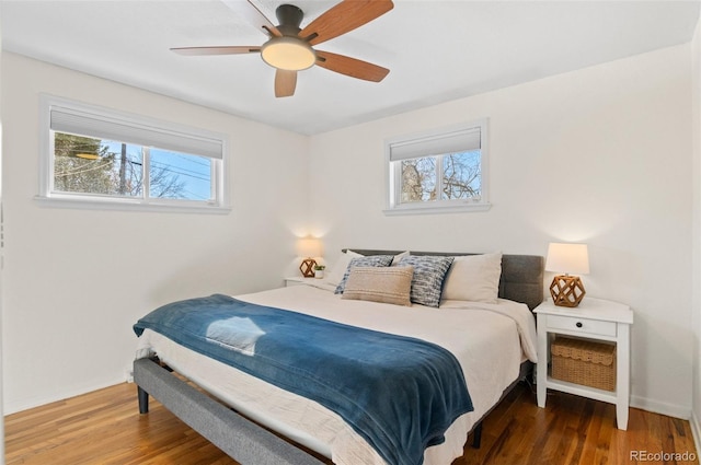 bedroom featuring dark hardwood / wood-style floors and ceiling fan