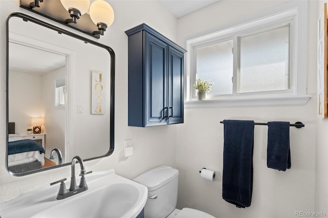 bathroom featuring sink and toilet