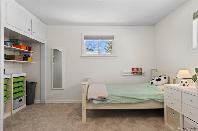 bedroom with light colored carpet