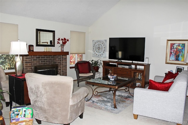 carpeted living room featuring vaulted ceiling and a brick fireplace