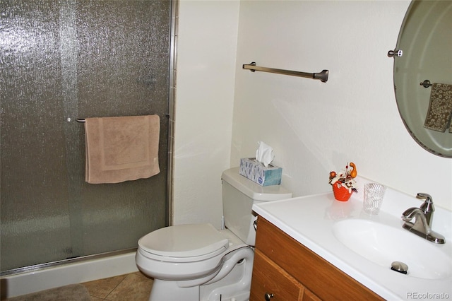 bathroom with a stall shower, tile patterned flooring, toilet, and vanity