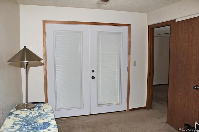 interior space with a textured ceiling