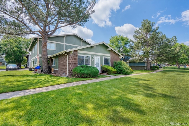 1216 S Uvalda St, Aurora, CO 80012 - view of front of home with a front lawn and brick siding