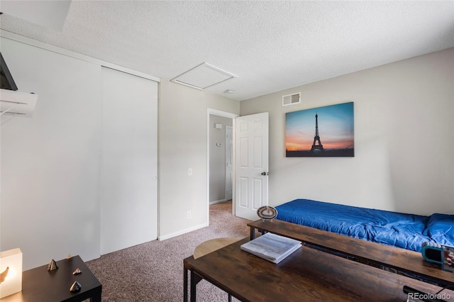 1216 S Uvalda St, Aurora, CO 80012 - carpeted bedroom featuring attic access, a textured ceiling, and baseboards