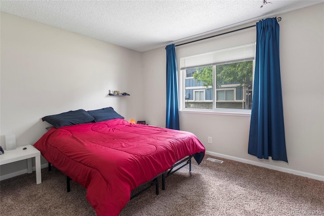 1216 S Uvalda St, Aurora, CO 80012 - carpeted bedroom featuring a textured ceiling and baseboards
