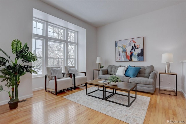 living room with light hardwood / wood-style floors