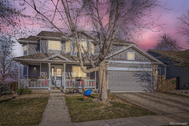 9990 Jasper St, Commerce City, CO 80022 - traditional-style house with a porch, concrete driveway, and an attached garage