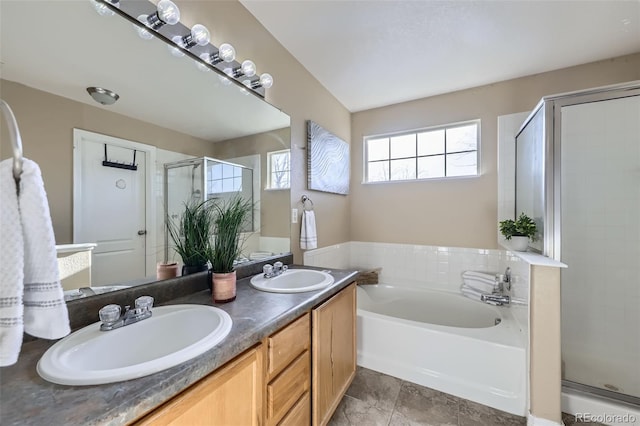 9990 Jasper St, Commerce City, CO 80022 - full bathroom featuring a bath, a shower stall, and double vanity