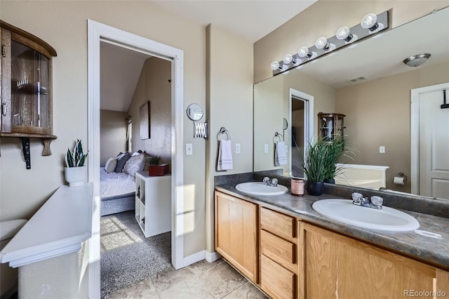 9990 Jasper St, Commerce City, CO 80022 - ensuite bathroom featuring double vanity and toilet