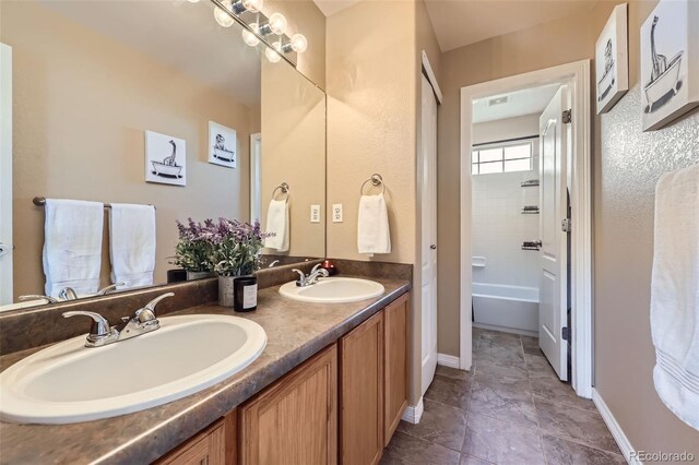 9990 Jasper St, Commerce City, CO 80022 - full bath featuring double vanity and baseboards