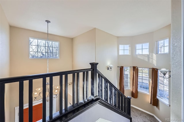9990 Jasper St, Commerce City, CO 80022 - staircase with carpet, a chandelier, and baseboards