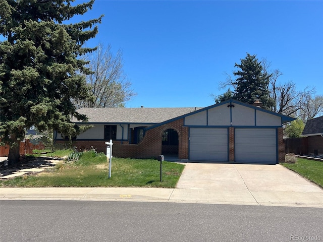 ranch-style home featuring an attached garage, driveway, and brick siding