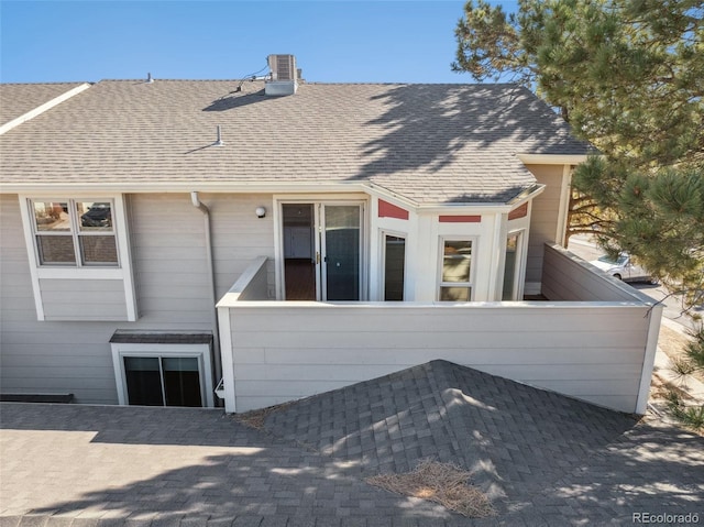 432 W Rockrimmon Blvd Unit B, Colorado Springs, CO 80919 - back of house with roof with shingles and a chimney