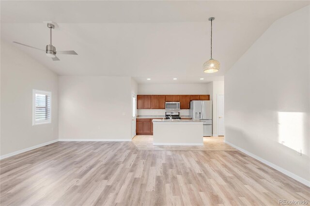 unfurnished living room featuring ceiling fan, high vaulted ceiling, and light wood-type flooring