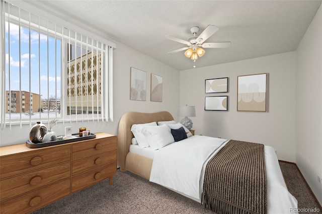 bedroom featuring a ceiling fan and light carpet