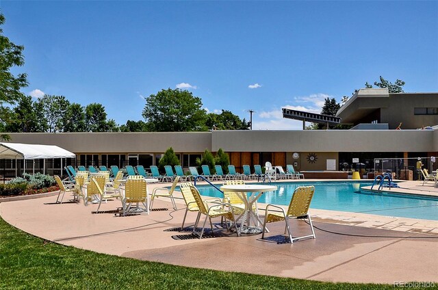 community pool with a patio