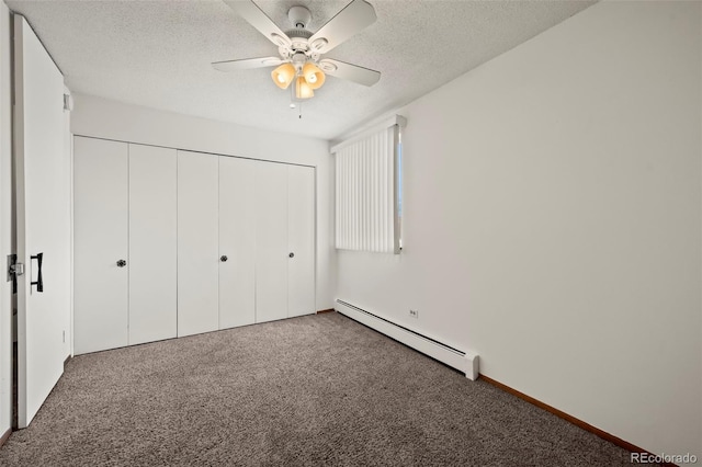 9300 E Center Ave Unit 2B, Denver, CO 80247 - unfurnished bedroom with baseboard heating, carpet floors, a closet, a textured ceiling, and ceiling fan