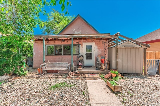 939 Conejos St, Colorado Springs, CO 80903 - view of front facade with a storage unit and stucco siding