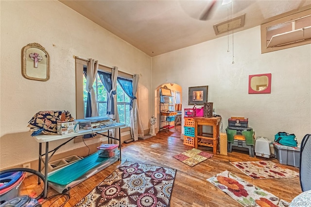 939 Conejos St, Colorado Springs, CO 80903 - game room with attic access, wood finished floors, a textured wall, and ceiling fan