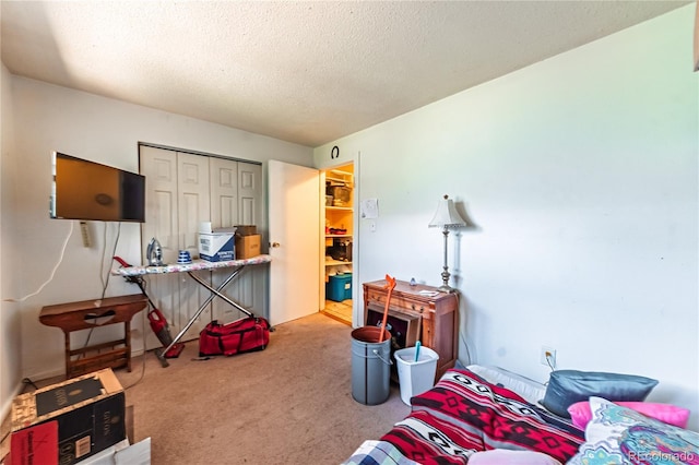 939 Conejos St, Colorado Springs, CO 80903 - carpeted bedroom featuring a textured ceiling and a closet
