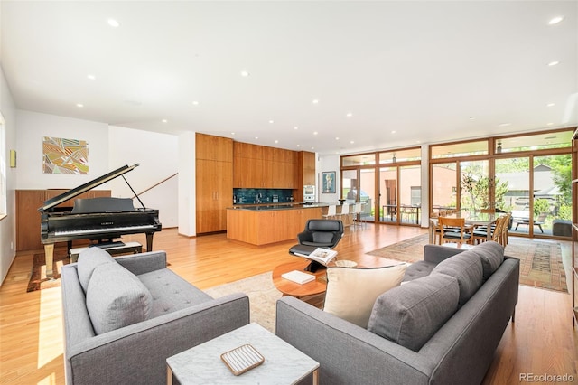 1188 S Sherman St, Denver, CO 80210 - living area featuring light wood-style floors, floor to ceiling windows, and recessed lighting