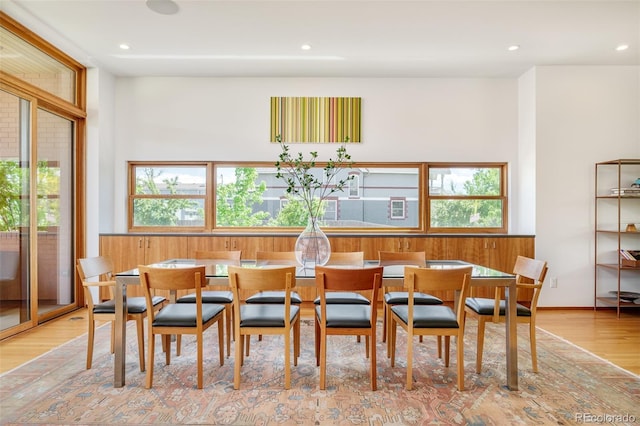 1188 S Sherman St, Denver, CO 80210 - dining area with light wood-type flooring and recessed lighting