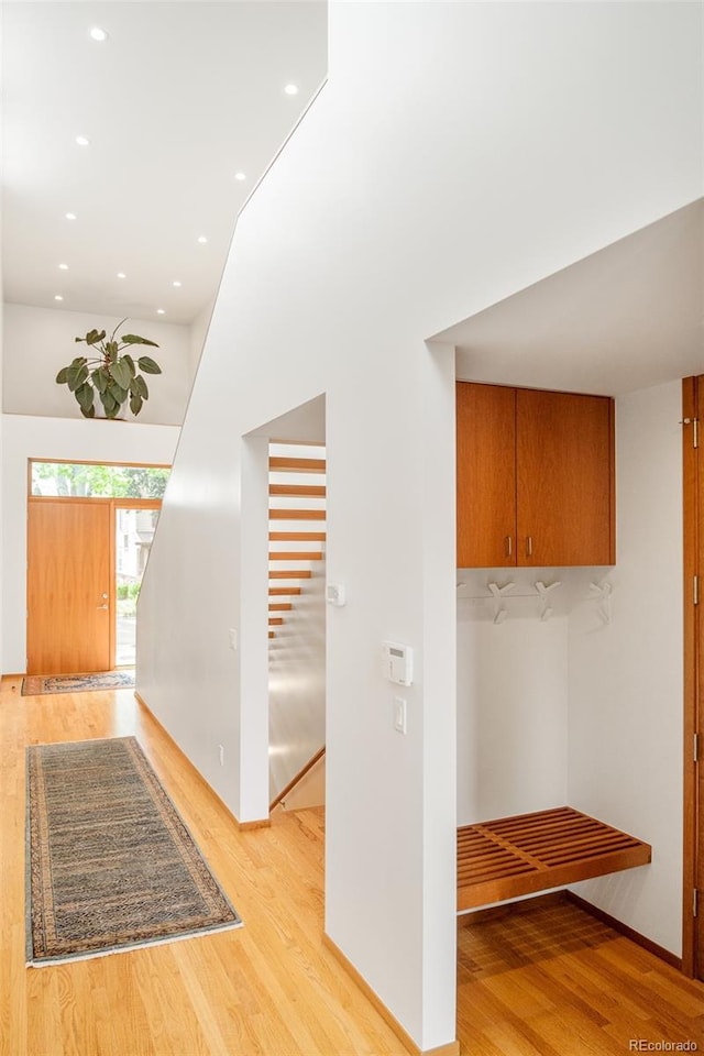 1188 S Sherman St, Denver, CO 80210 - corridor featuring light wood-style flooring, recessed lighting, a towering ceiling, and baseboards