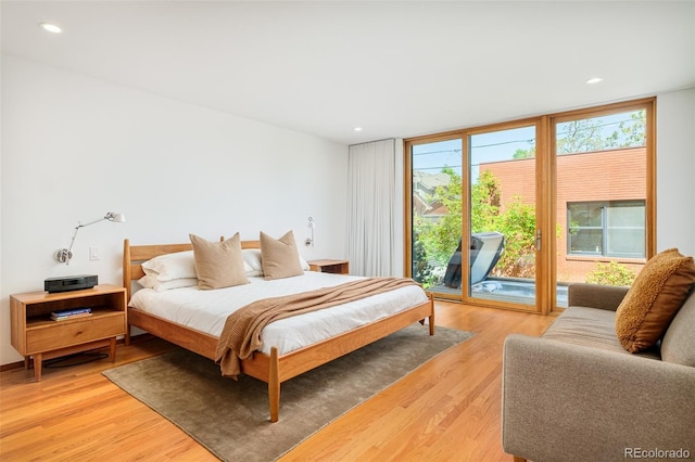 1188 S Sherman St, Denver, CO 80210 - bedroom featuring access to outside, floor to ceiling windows, light wood-style flooring, and recessed lighting