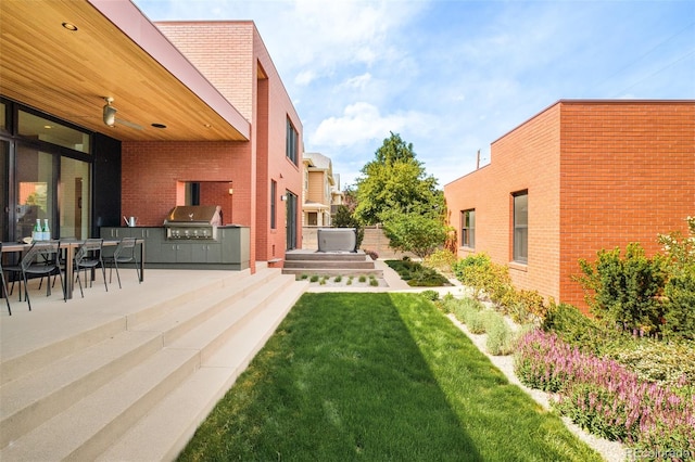 1188 S Sherman St, Denver, CO 80210 - view of green lawn with an outdoor kitchen