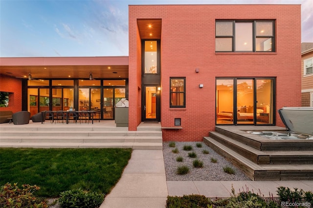 1188 S Sherman St, Denver, CO 80210 - back of property with brick siding and a patio area