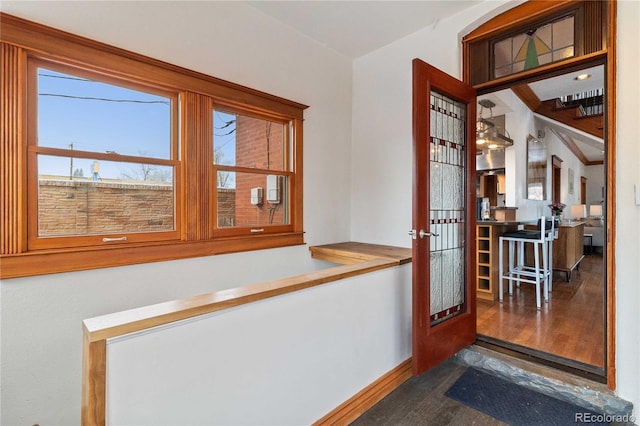 dining area featuring dark wood-type flooring, french doors, and baseboards