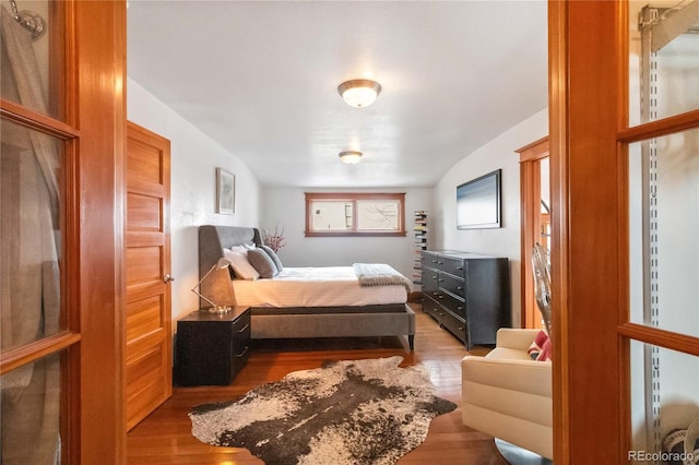 bedroom featuring wood finished floors