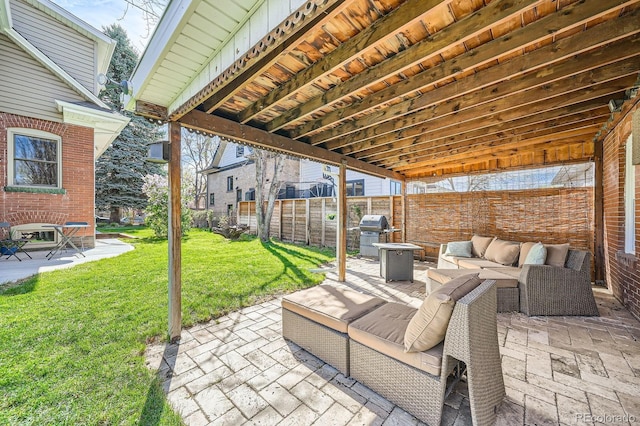 view of patio / terrace featuring grilling area and an outdoor living space with a fire pit