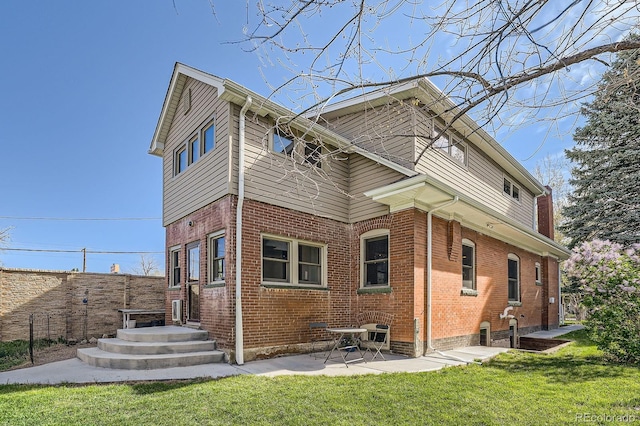 3777 Newton St, Denver, CO 80211 - back of house featuring brick siding and a patio