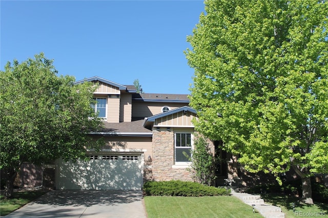 2601 Pemberly Ave, Highlands Ranch, CO 80126 - view of front of property with an attached garage, stone siding, driveway, and board and batten siding